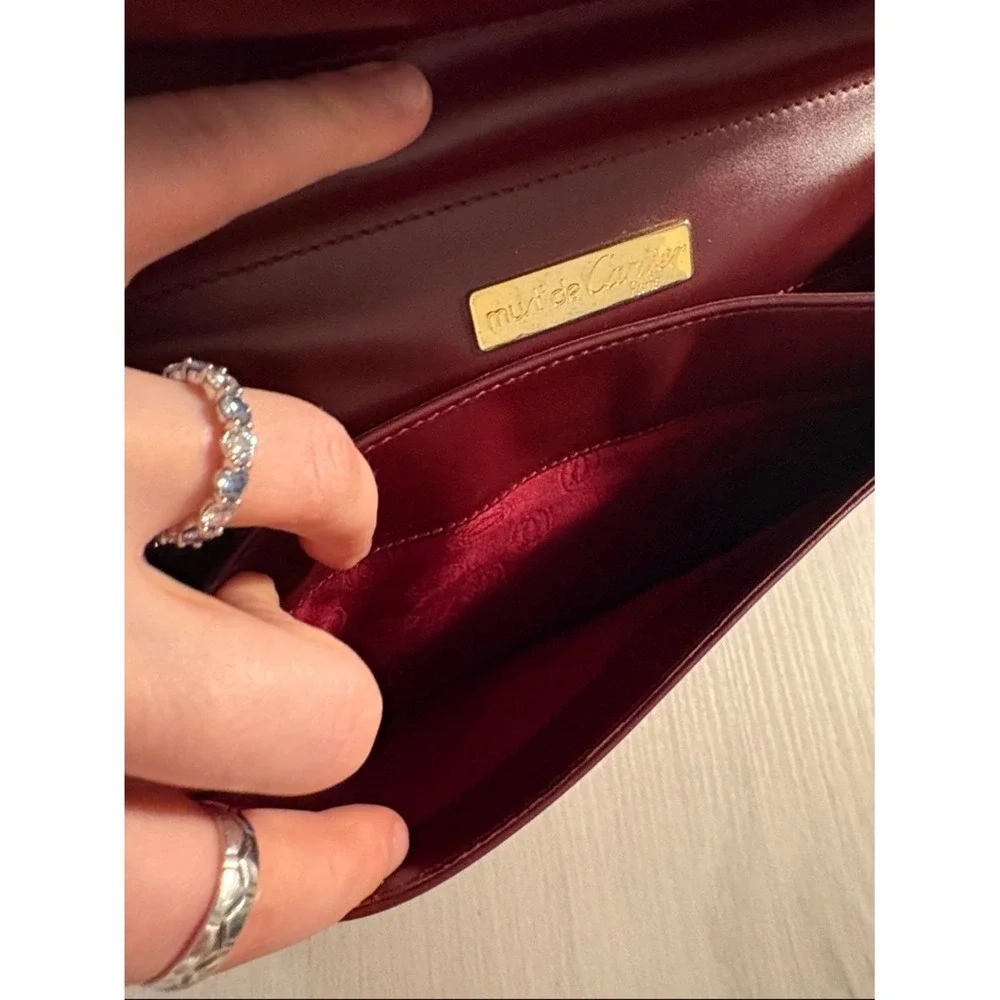 Cartier Burgundy Leather wristlet with Gold Corners‎